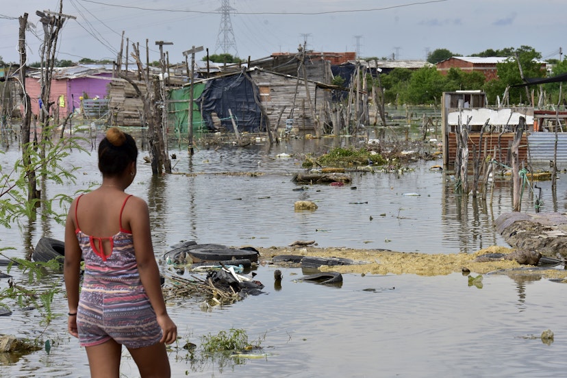 CARTAGENA, COLOMBIA - NOVEMBER 17: A woman resident of the Nuevo Paraiso neighborhood on the island of Belen looks at the flooded site where houses existed after the passage of Hurrican Iota on November 17, 2020 in Cartagena, Colombia. Hurricane Iota hit Colombia's Caribbean coast and Islands of San Andrés and Providencia as category five storm on Monday, producing floods and damages. Since records are kept, Iota is the strongest storm to hit the country. (Photo by Javier Garcia Salcedo/Vizzor Image/Getty Images)