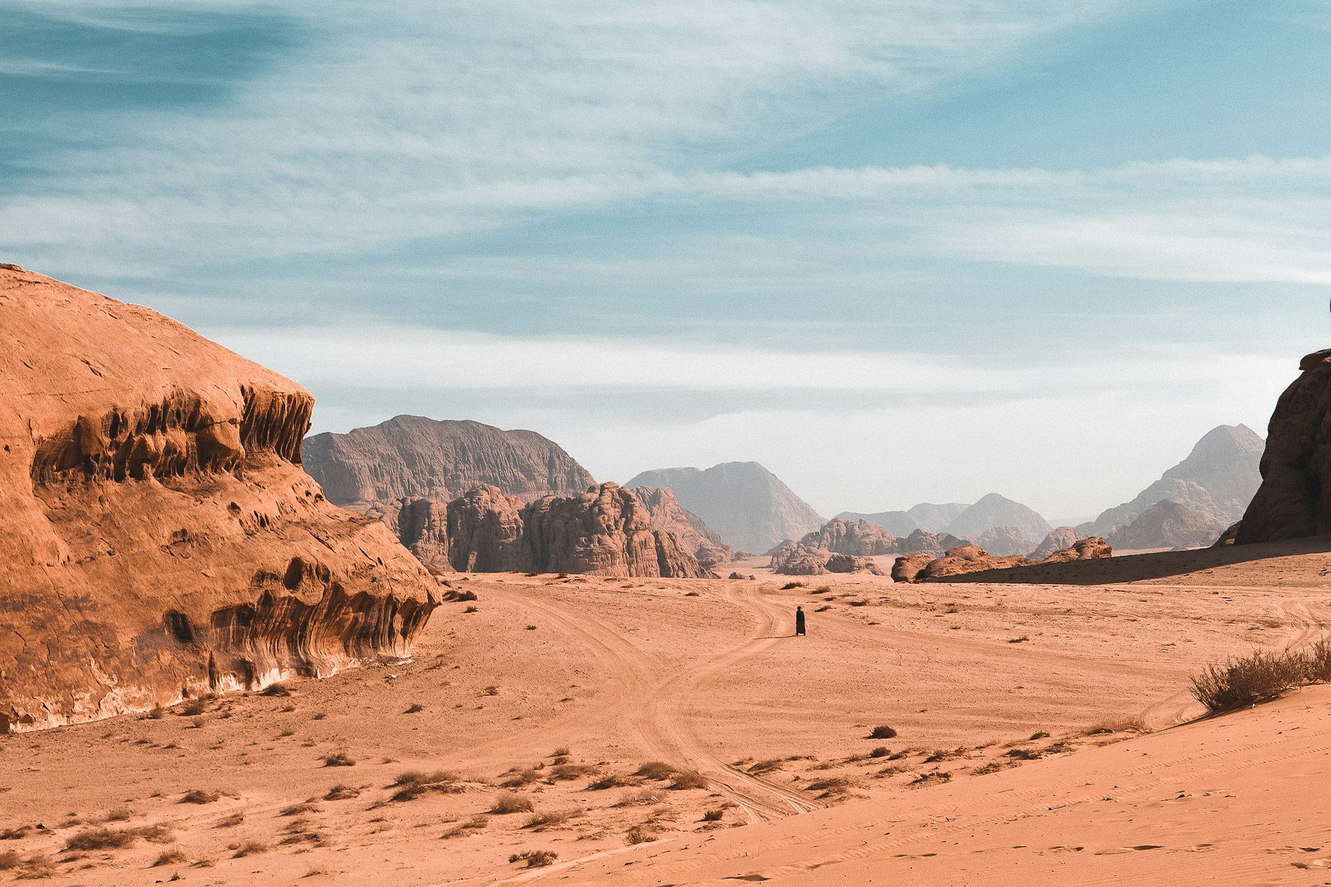A human figure in a desert landscape
