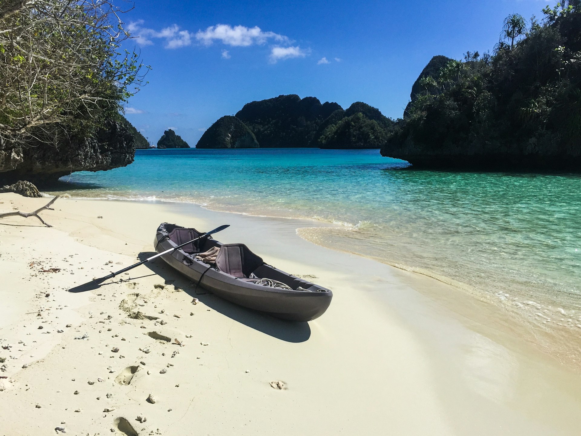 Empty kayak on a remote beach