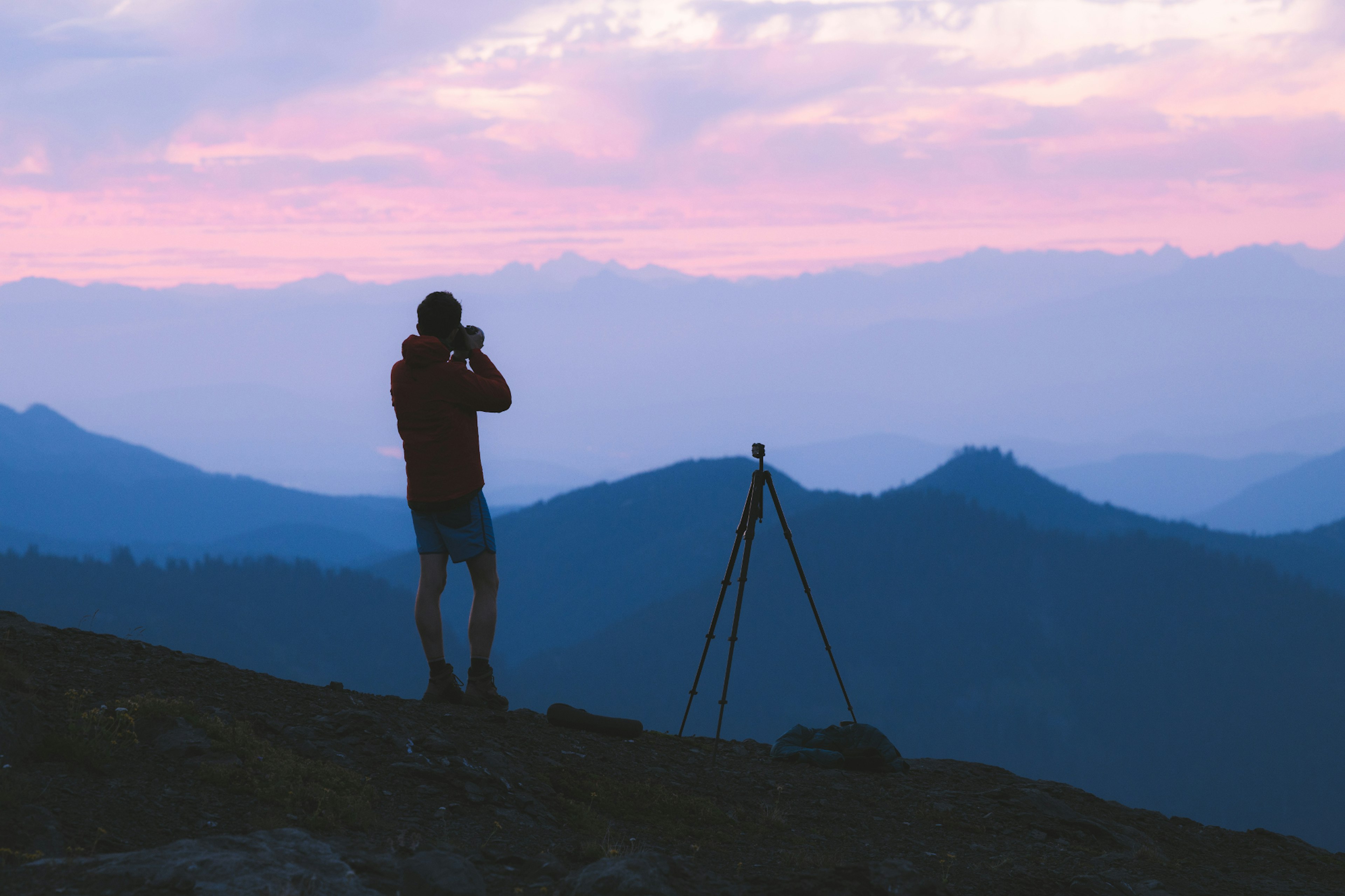 Nathaniel capturing a photograph in nature