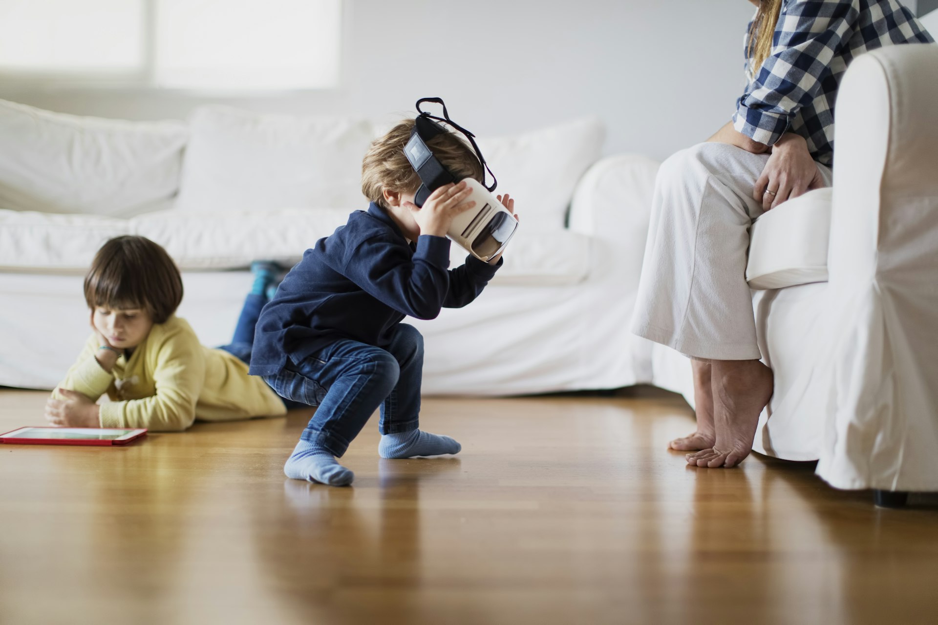 Young boy using a virtual reality headset at home