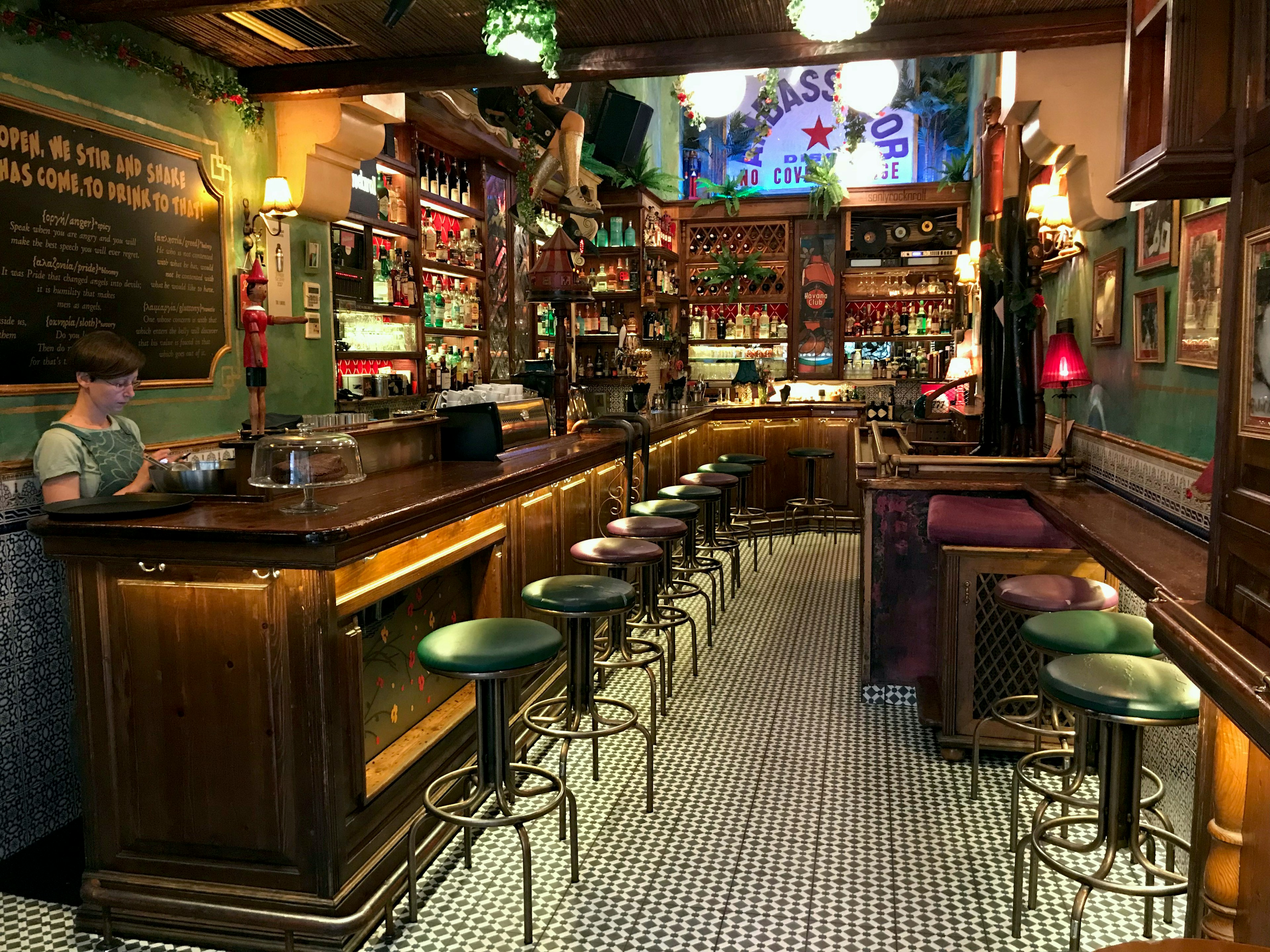 Interior of Seven Jokers wooden bar and checkered tile in the Syntagma neighbourhood