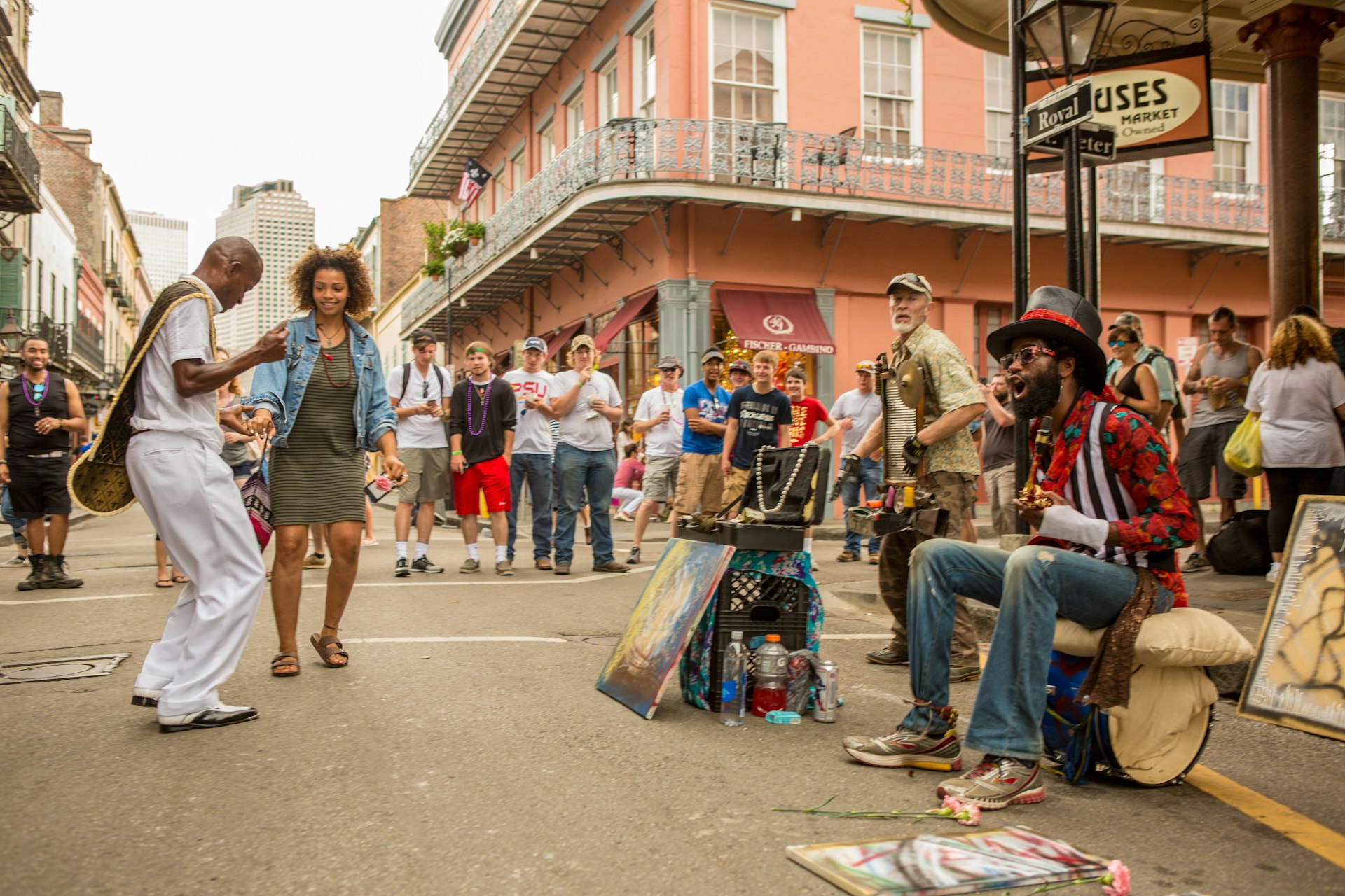 People dancing to music on a street corner in the French Quarter in New Orleans, Louisiana