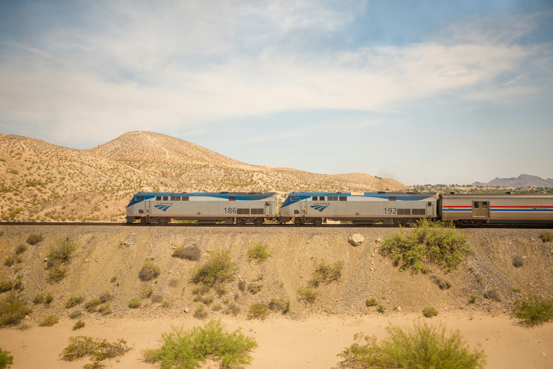 A train crossing a desert-like area