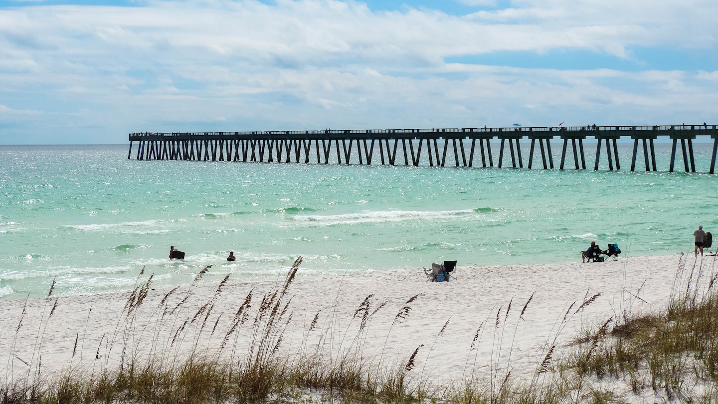 The fishing pier at Navarre Beach is an iconic part of the coastal view © Adine Versluis / Shutterstock