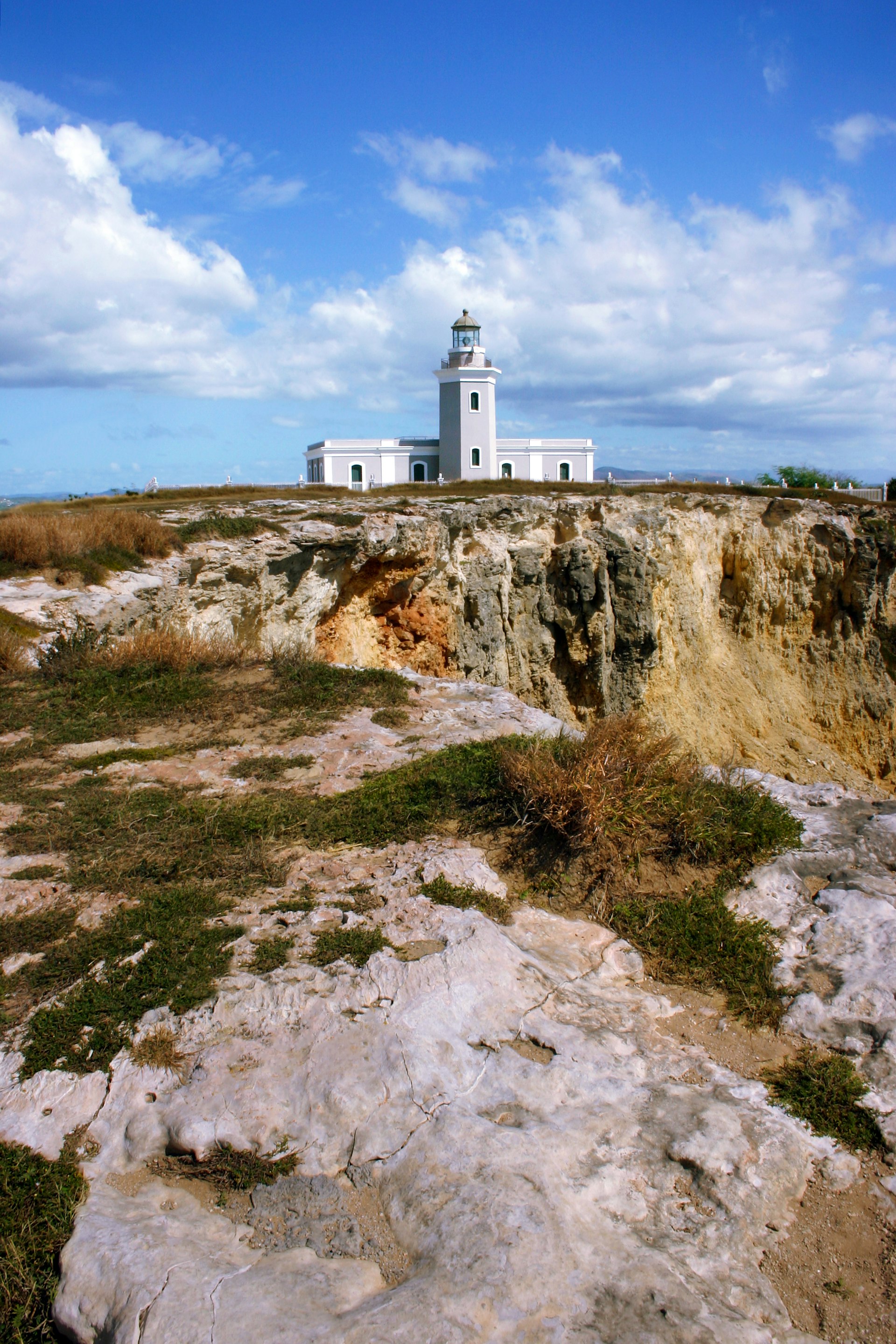 The Los Morrillos Lighthouse sits on rocky limestone cliffs in, Cabo Rojo, Puerto Rico