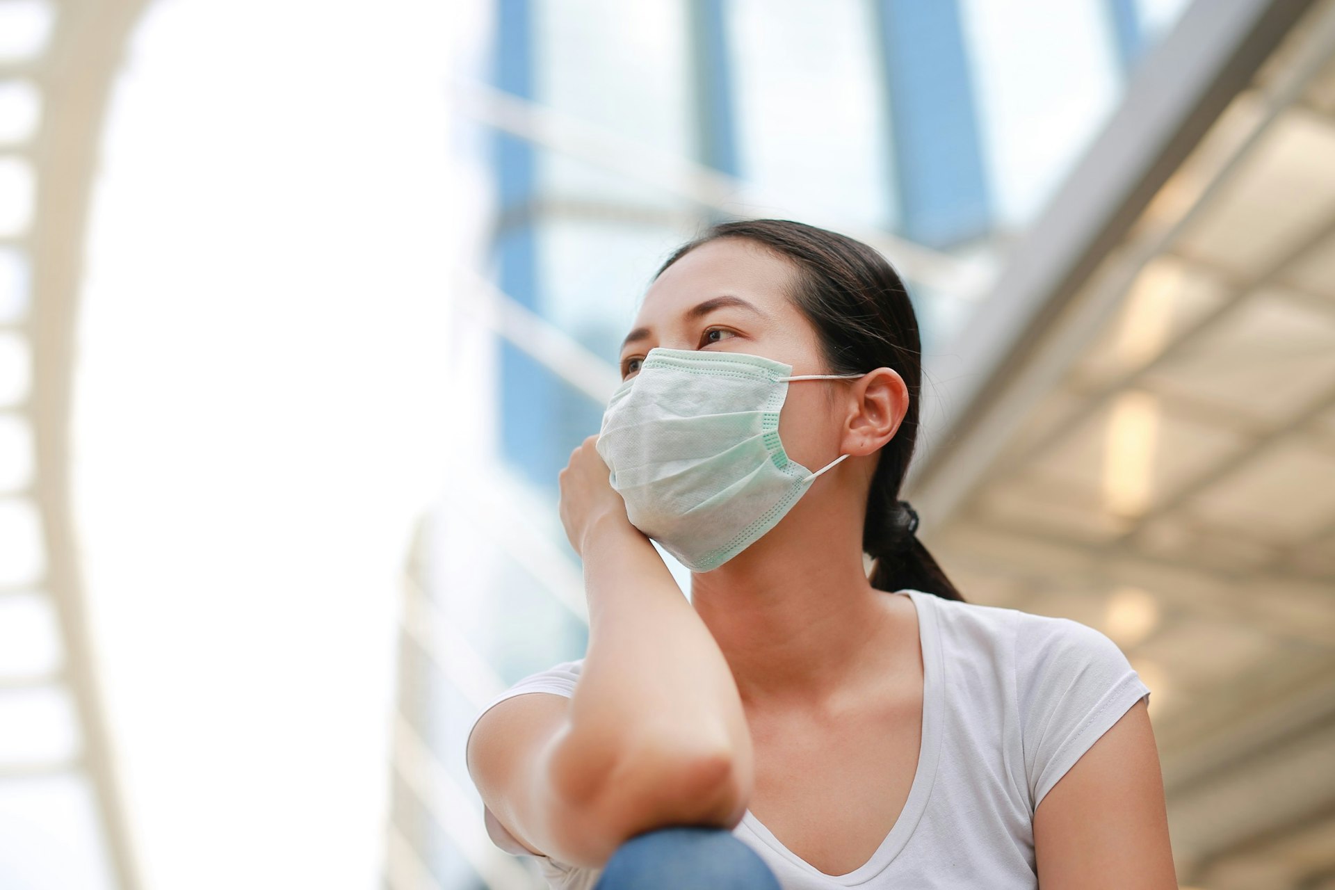 A woman wearing a face mask at the airport