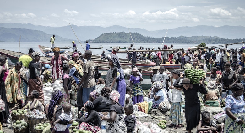 Vendors and shoppers at Kituku market on the shores of Lake Kivu in Goma, eastern Democratic Republic of Congo, April 2, 2020. Many Congolese survive on their daily earnings and cannot afford to follow health advisories on maintaining social distance.