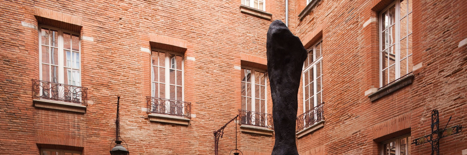 Musee Paul Dupuy museum, exterior and sculpture, Leg of a Horse by Daniel Coulet