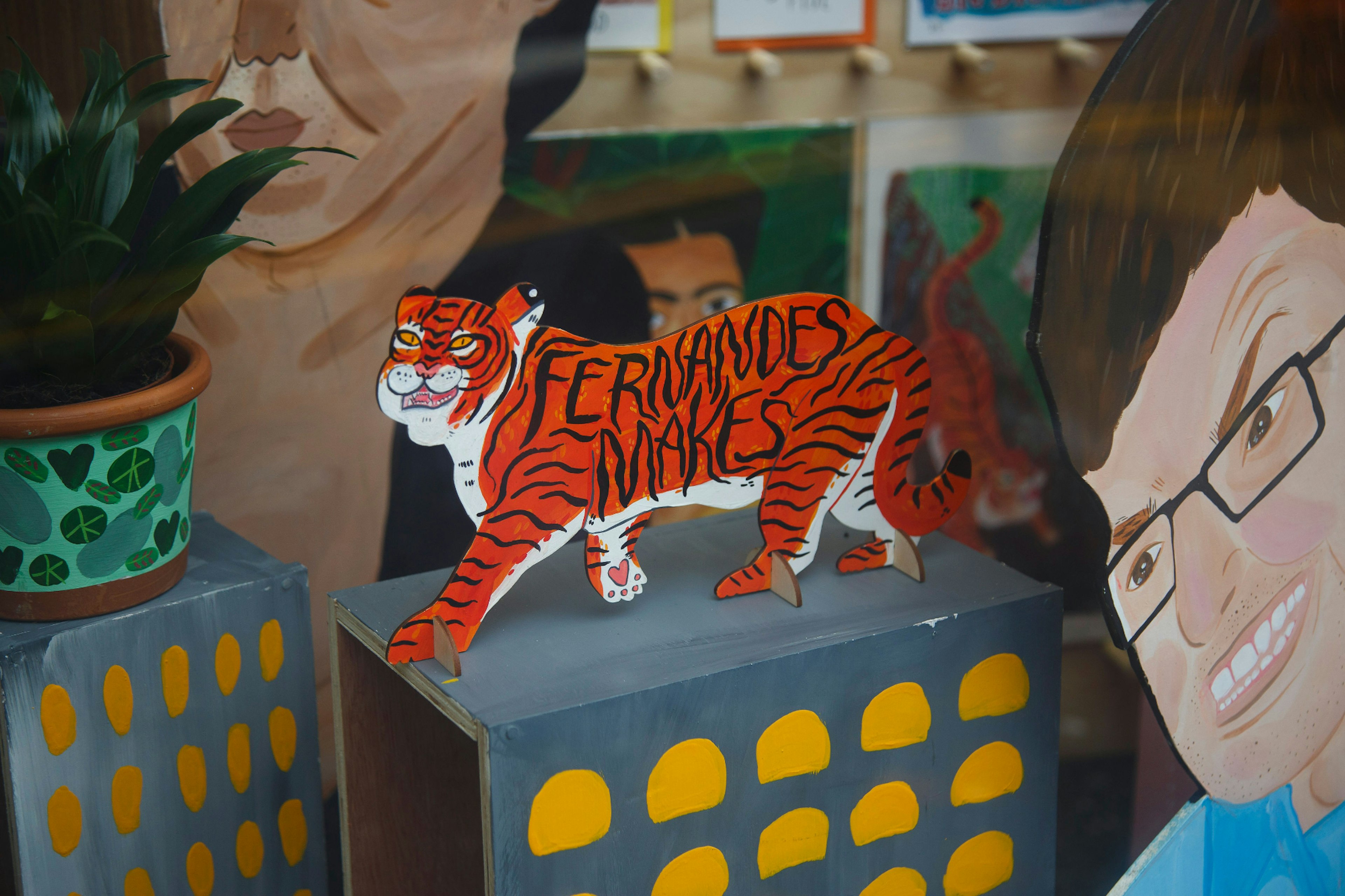 Artwork of a tiger by Nicola Fernandes in a shop window in Manchester