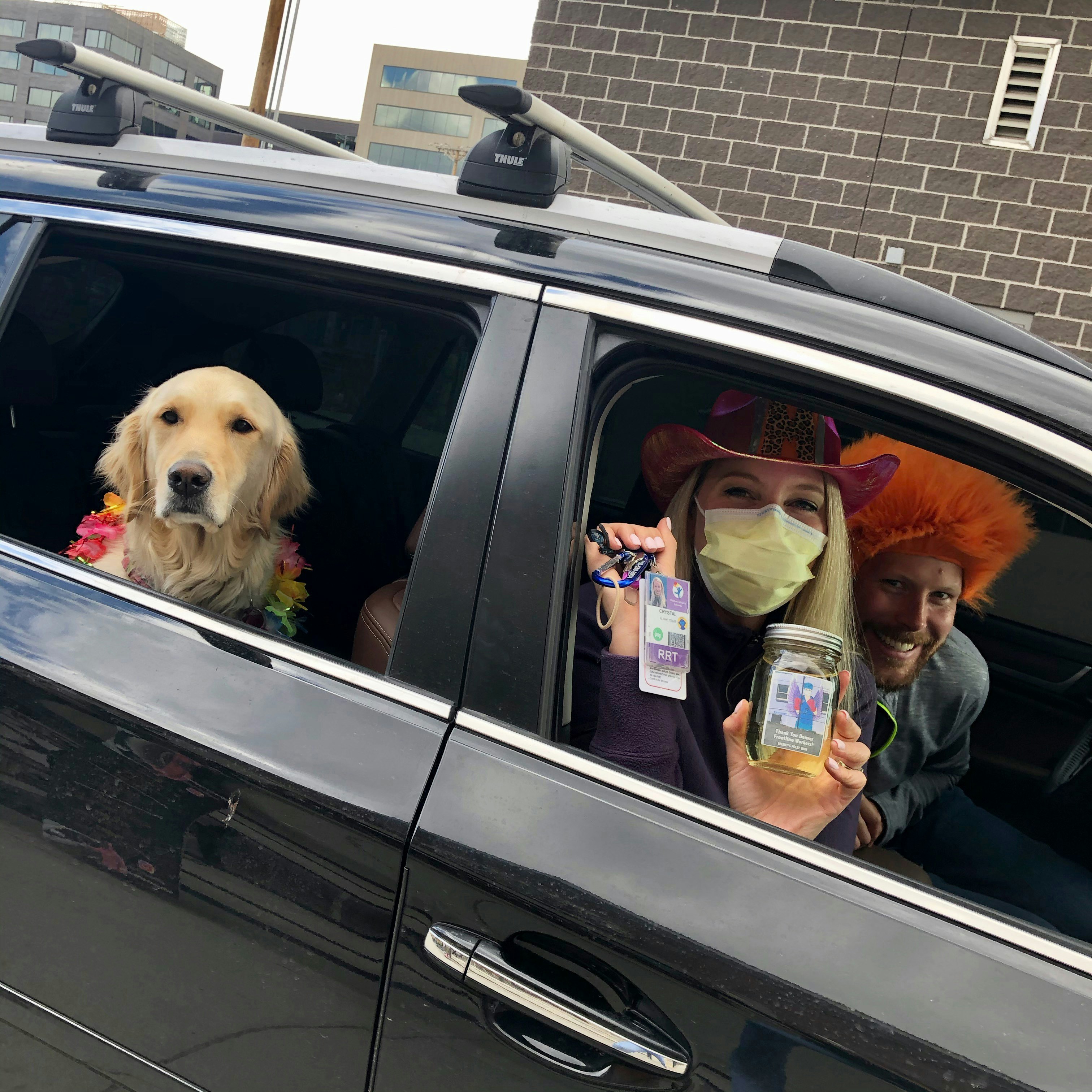 Nurse dressed up in car picking up free wine pint copy.jpg