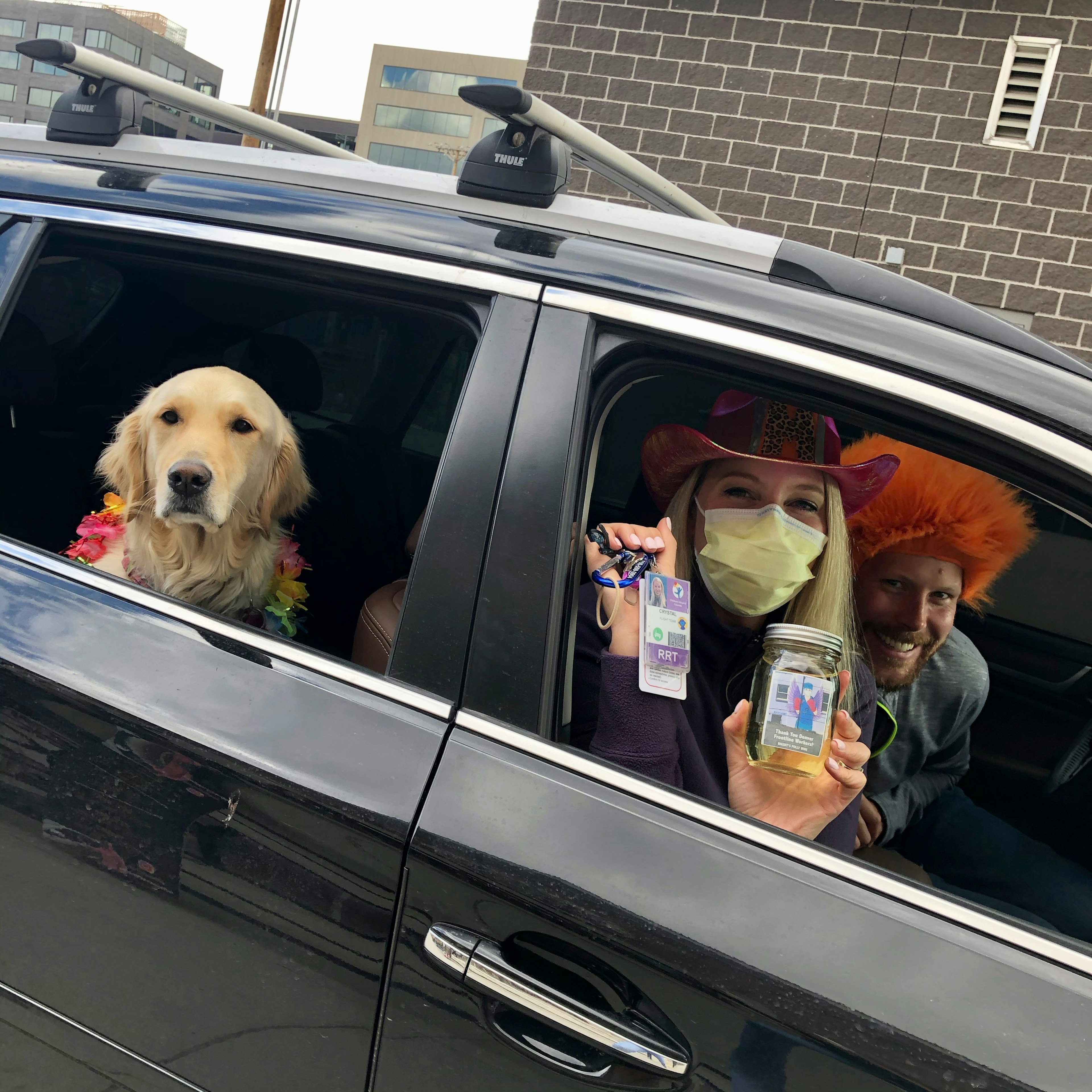 Nurse dressed up in car picking up free wine pint