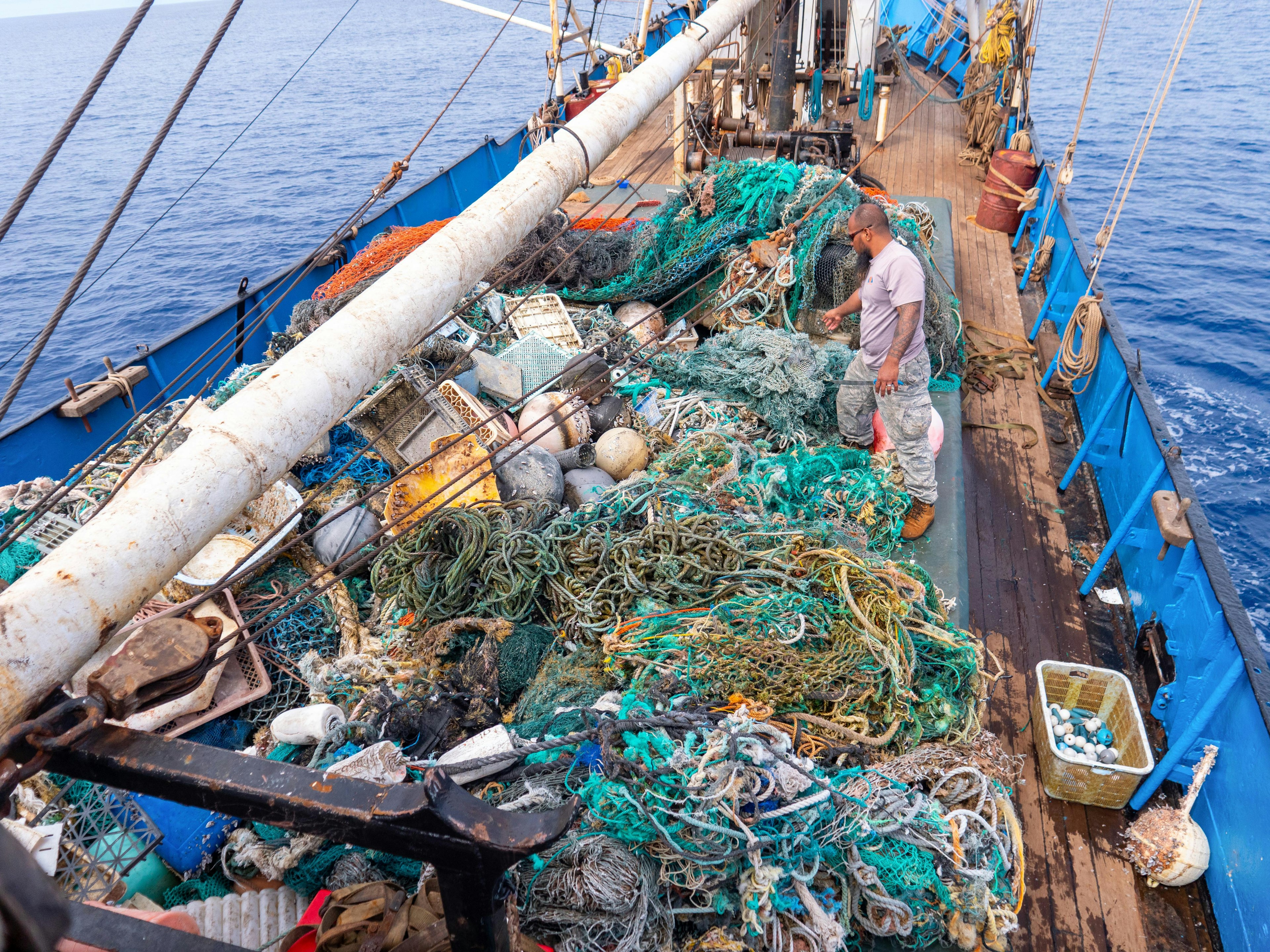 Rubbish lines the deck of a cargo ship involved in an ocean clean-up mission