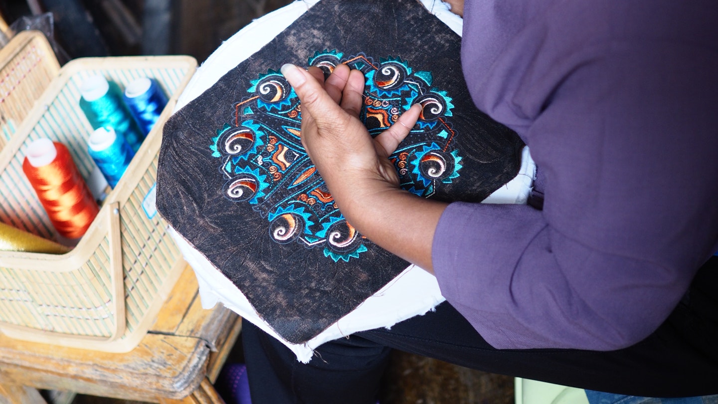Colorful embroidery is one way the Miao preserve and express their culture