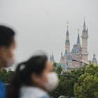 SHANGHAI, CHINA - MAY 05: Tourists at Disney town on May 05, 2020 in Shanghai, China. After decades of growth, officials said Chinas economy had shrunk in the latest quarter due to the impact of the coronavirus epidemic. The slump in the worlds second largest economy is regarded as a sign of difficult times ahead for the global economy. While industrial sectors in China are showing signs of reviving production, a majority of private companies are operating at only 50% capacity, according to analysts. With the pandemic hitting hard across the world, officially the number of coronavirus cases in China is dwindling, ever since the government imposed sweeping measures to keep the disease from spreading. Officials believe the worst appears to be over in China, though there are concerns of another wave of infections as the government attempts to reboot the worlds second largest economy. (Photo by Hu Chengwei/Getty Images)