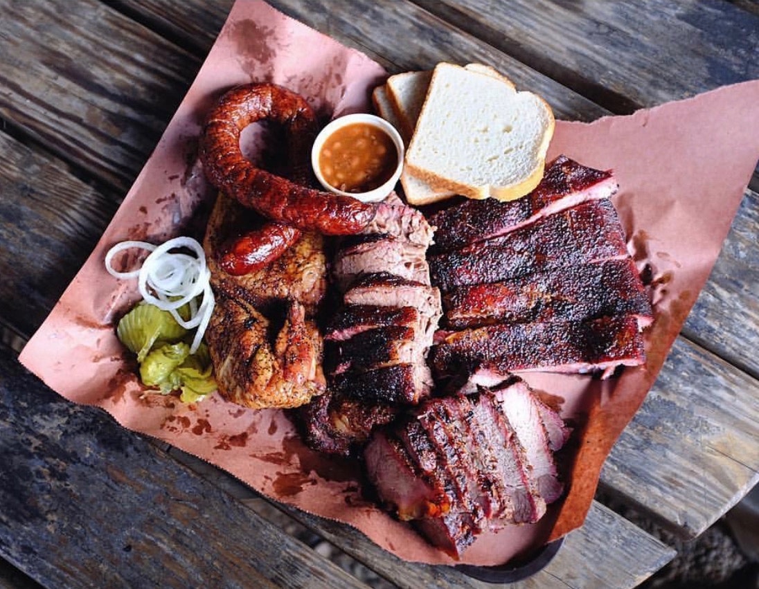 A tray of sliced meat and sausage at Snow's BBQ