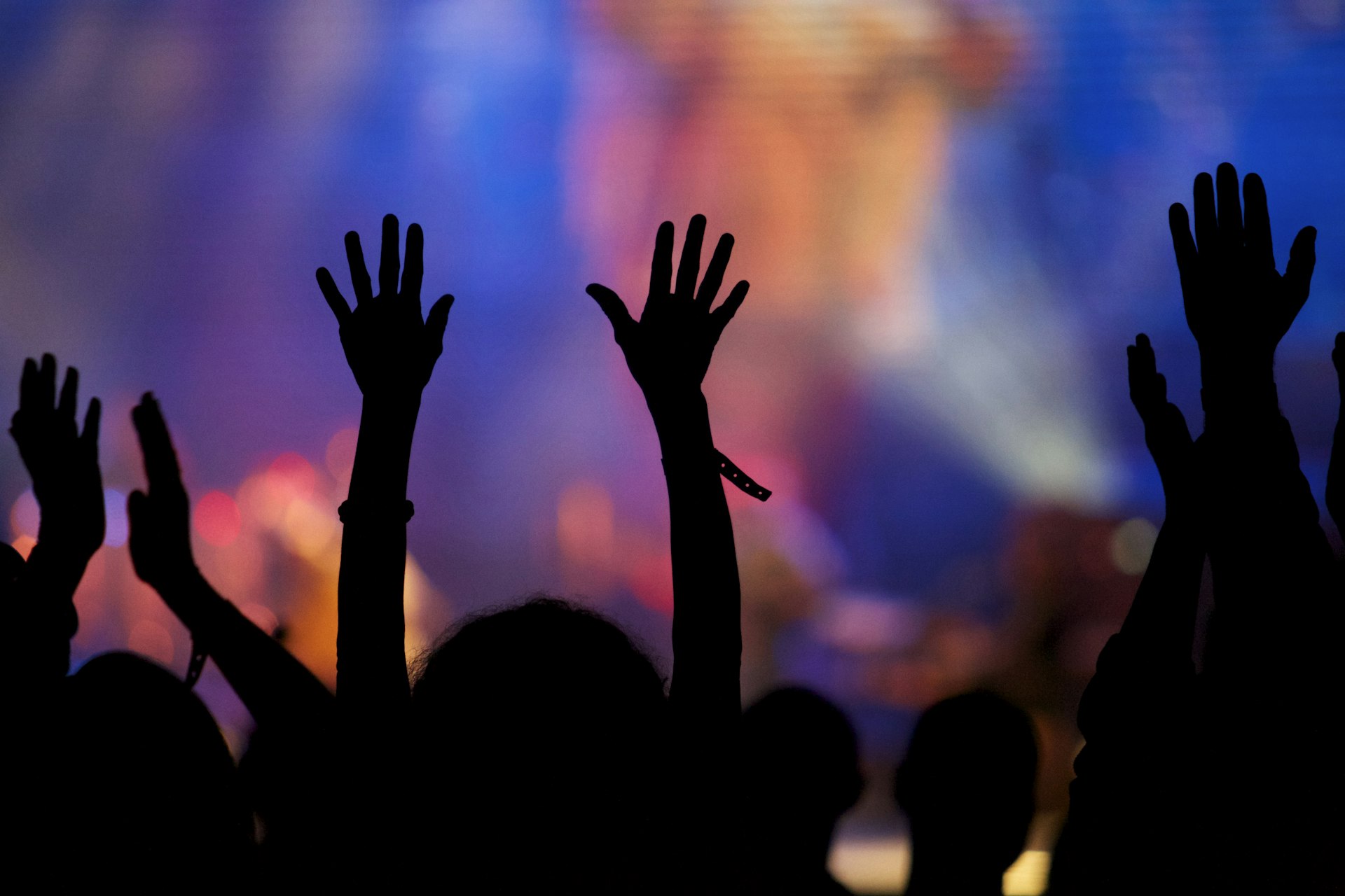 Hands raised at a concert