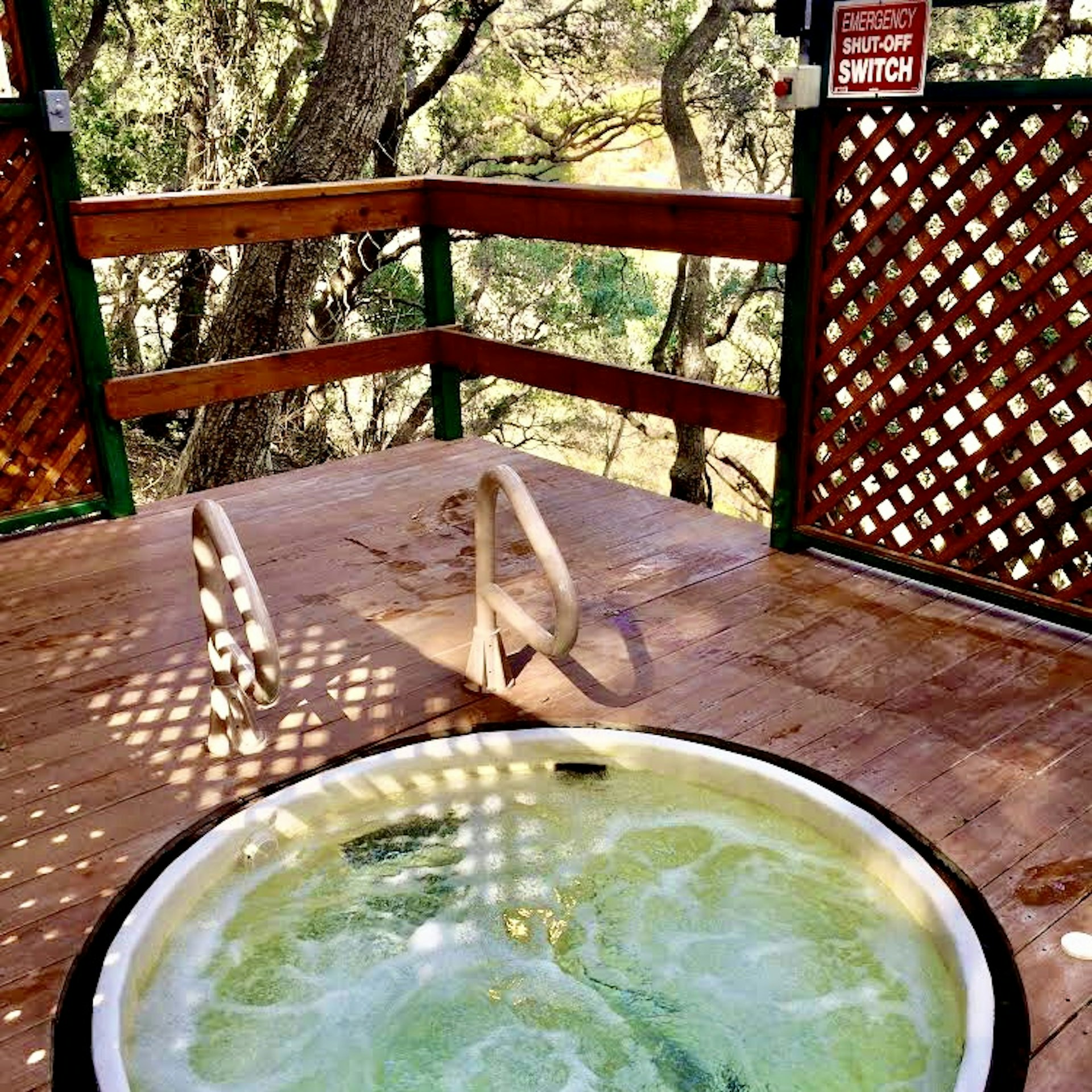 A bubbling hot tub with trees in the background