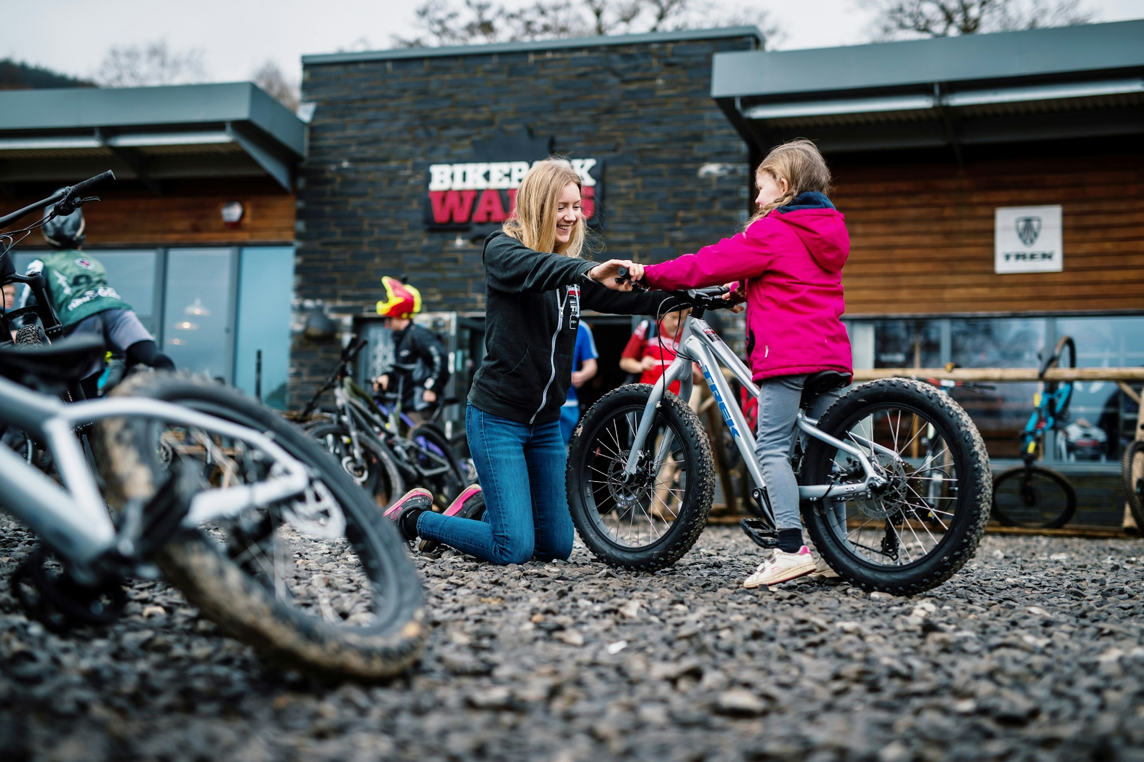 TravMedia_United_Kingdom_1426124_BikePark Wales_Young rider being set up on a hire bike.jpg