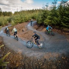 TravMedia_United_Kingdom_1426127_Family on hairpin bend at new beginner mountain bike trail at Bike Park Wales.jpg
