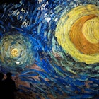 TOPSHOT - People attend a press visit of the immersive exhibition "Nuit Etoilée" devoted to painter Vincent Van Gogh by multimedia artist Gianfranco Iannuzzi, on February 8, 2019, at "l'Atelier des Lumieres", the first Digital Art Centre in Paris. - The Art center will host an immersive exhibition "Nuit Etoilée" devoted to painter Vincent Van Gogh by multimedia artist Gianfranco Iannuzzi from february 22 to December 31, 2019. (Photo by Lionel BONAVENTURE / AFP) / RESTRICTED TO EDITORIAL USE - MANDATORY MENTION OF THE ARTIST UPON PUBLICATION - TO ILLUSTRATE THE EVENT AS SPECIFIED IN THE CAPTION        (Photo credit should read LIONEL BONAVENTURE/AFP via Getty Images)