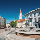 St. Nicholas Church and the fountain in Rotuses Square In Old Town. Vilnius.