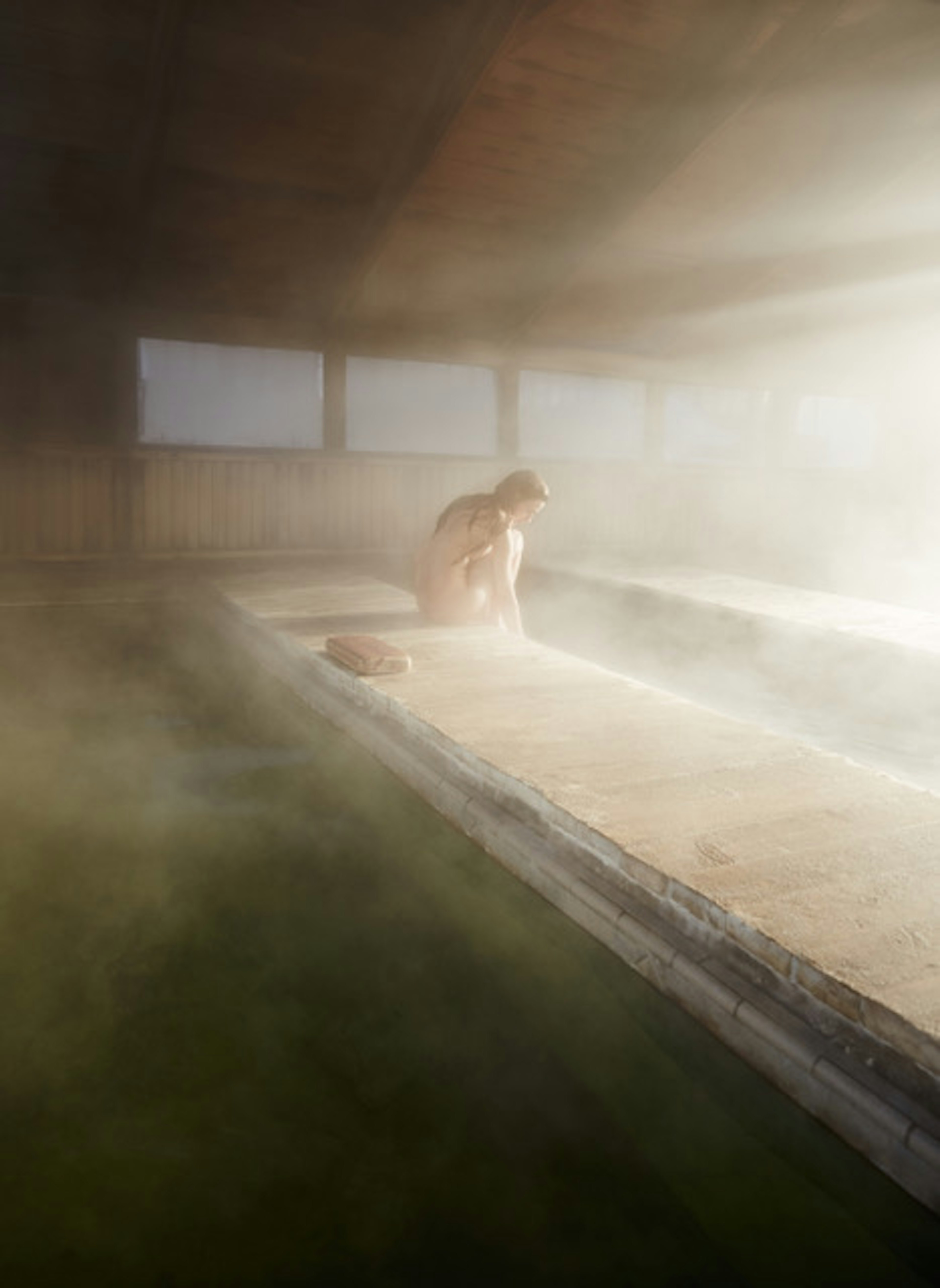 A woman in a steamy room