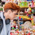 Young woman buying souvenirs in gift shop