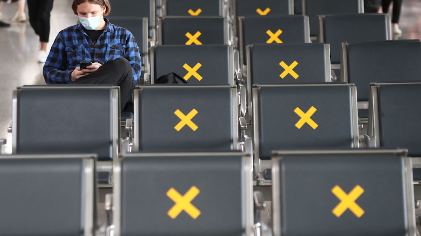 MOSCOW, RUSSIA - JUNE 10, 2020: A man in a face mask in the departure area at Vnukovo International Airport, its management set to gradually ease public health safety measures imposed at the onset of the COVID-19 pandemic in Russia. Sergei Karpukhin/TASS (Photo by Sergei Karpukhin\TASS via Getty Images)