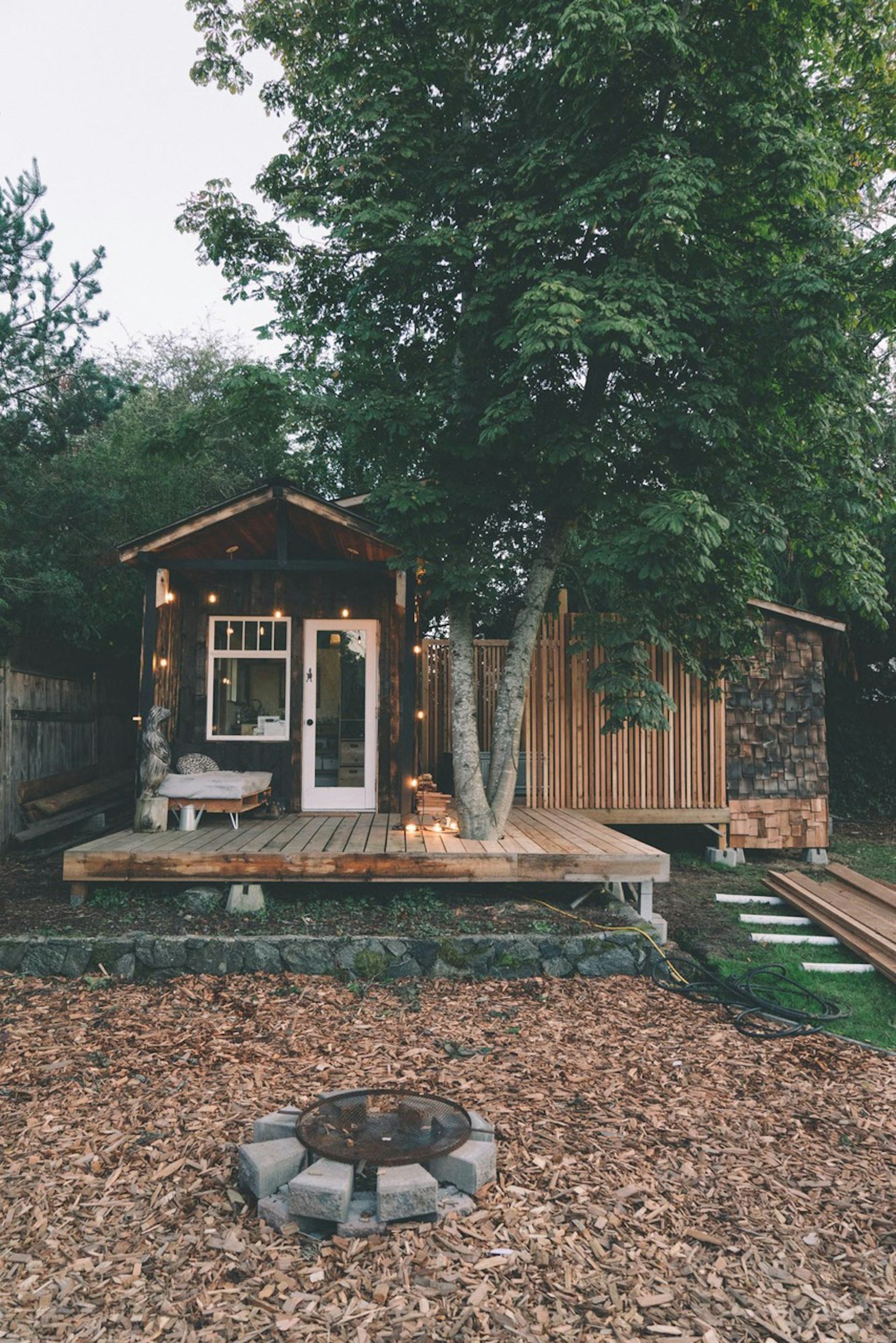 Cabin in the woods surrounded by trees 