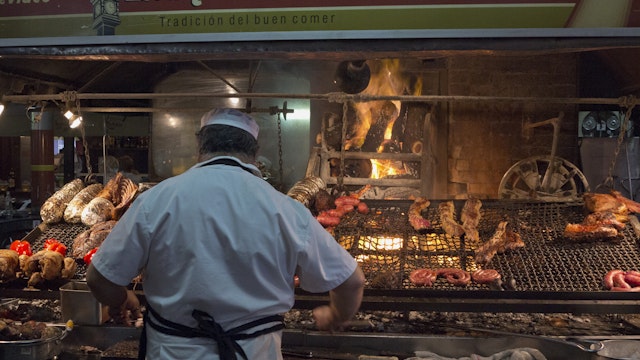 'Parilla' Barbeque Restaurant In The Mercado Del Puerto, Montevideo, Uruguay. (Photo by: Julio Etchart/Majority World/Universal Images Group via Getty Images)