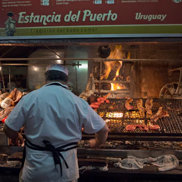 'Parilla' Barbeque Restaurant In The Mercado Del Puerto, Montevideo, Uruguay. (Photo by: Julio Etchart/Majority World/Universal Images Group via Getty Images)