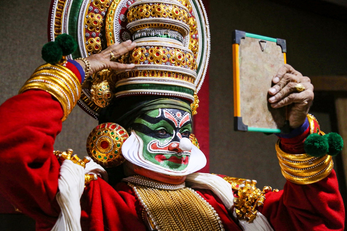 An artist from the Kathakali School Society of Thrissur prepares backstage for his performance in a programme organised by Madhya Pradesh Tribal Museum in Bhopal on June 18, 2018. (Photo by - / AFP)        (Photo credit should read -/AFP/Getty Images)