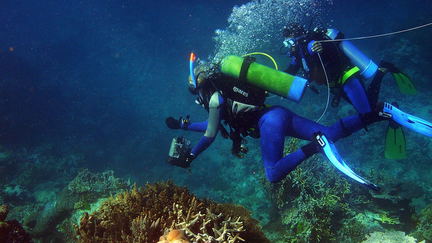 (AUSTRALIA OUT) Katrina Goudkamp videos coral with the help of Aboriginal trainee Lwayne Boslem as The Great Barrier Reef Marine Park Authority conducts a survey of the bleaching on the Reef from Gladstone to Cooktown, 6 April 2006. THE AGE Picture by SANDY SCHELTEMA (Photo by Fairfax Media via Getty Images/Fairfax Media via Getty Images via Getty Images)
