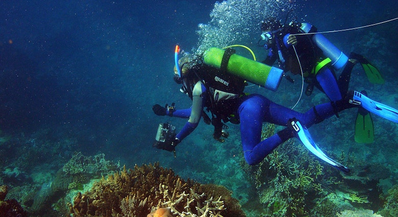 (AUSTRALIA OUT) Katrina Goudkamp videos coral with the help of Aboriginal trainee Lwayne Boslem as The Great Barrier Reef Marine Park Authority conducts a survey of the bleaching on the Reef from Gladstone to Cooktown, 6 April 2006. THE AGE Picture by SANDY SCHELTEMA (Photo by Fairfax Media via Getty Images/Fairfax Media via Getty Images via Getty Images)