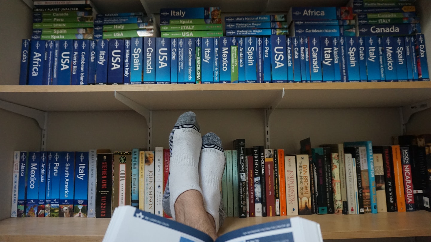 A shelf of Lonely Planet guidebooks