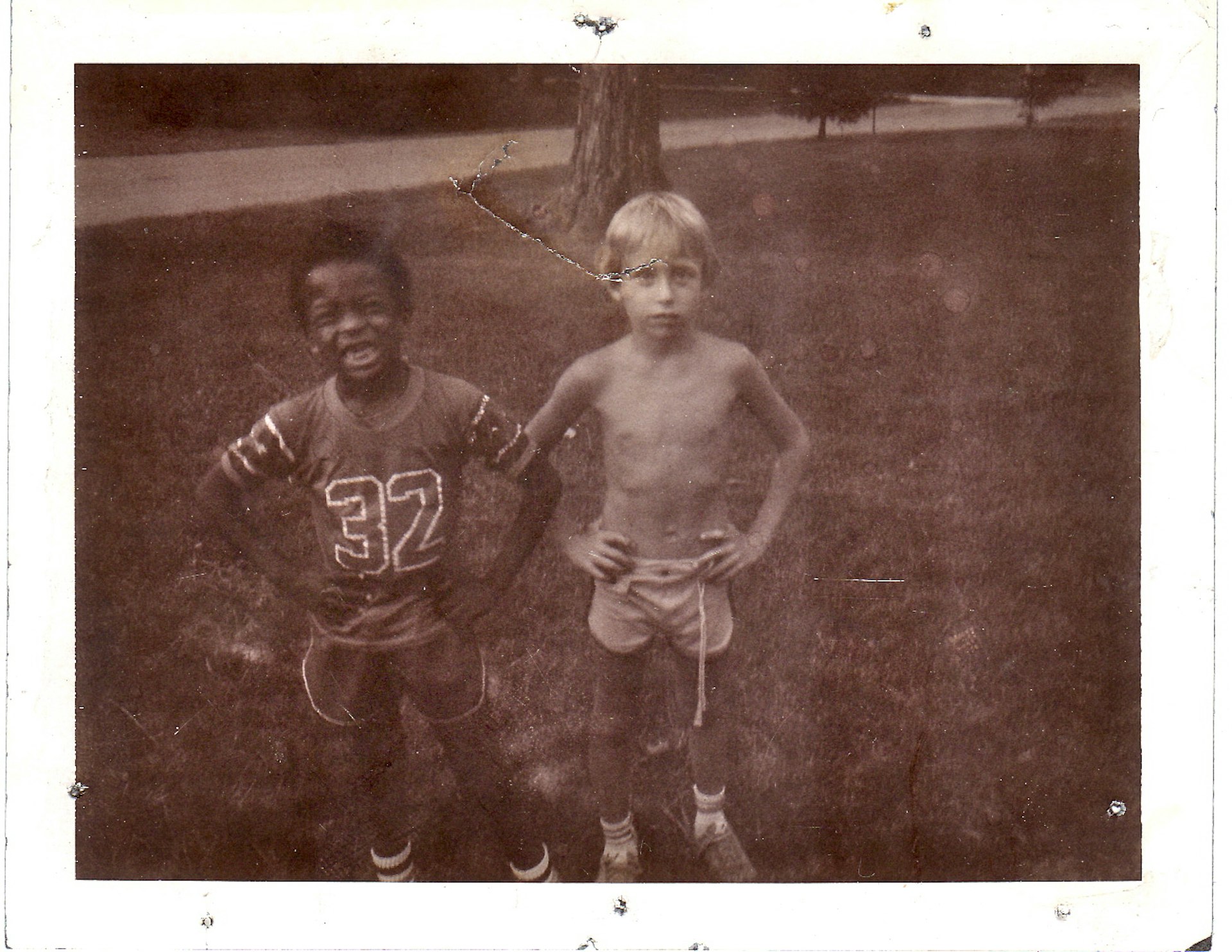 Two young boys in a black-and-white photo
