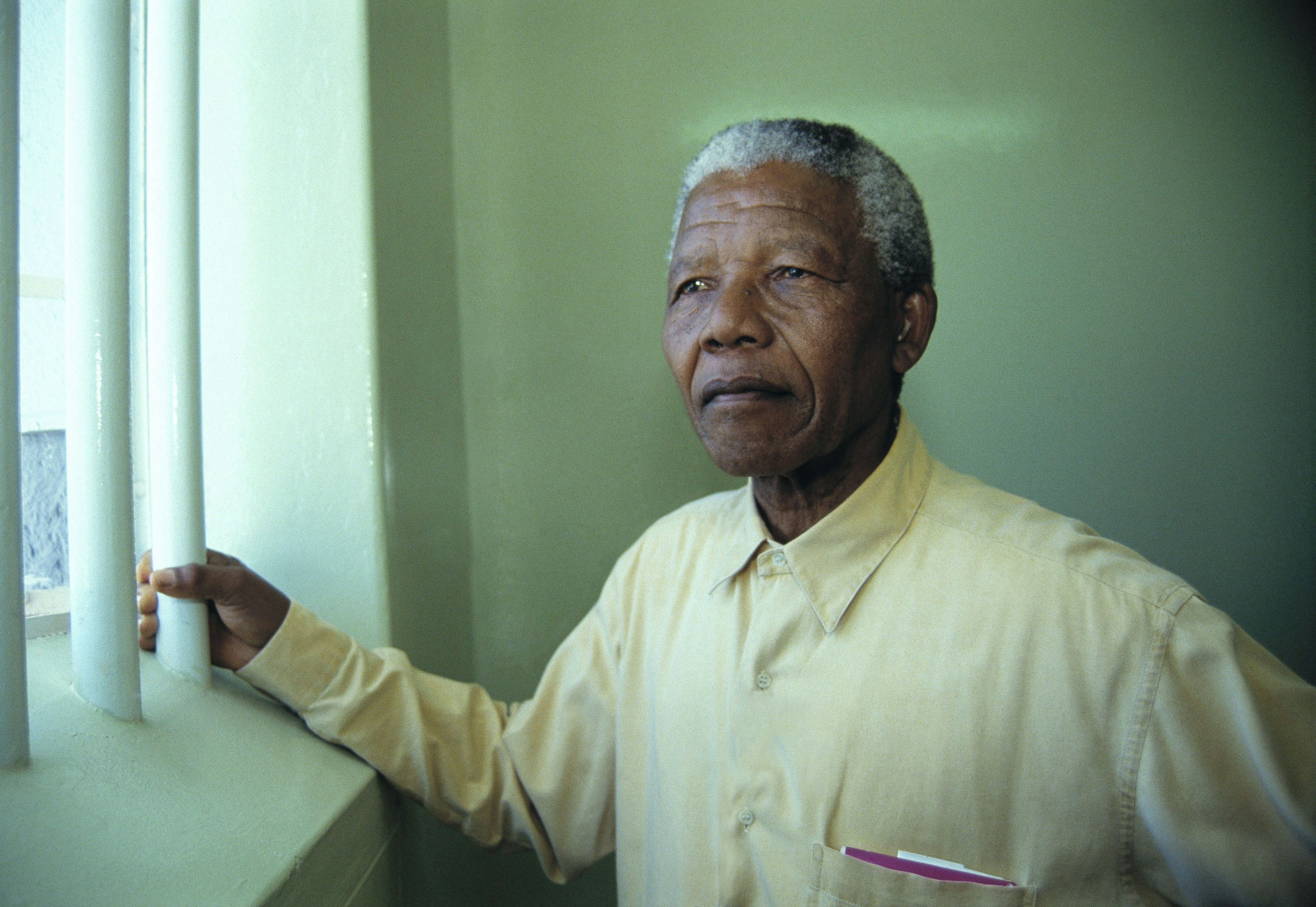 Nelson Mandela revisits the cell at Robben Island prison in February 1994 where he was jailed for more than two decades. 