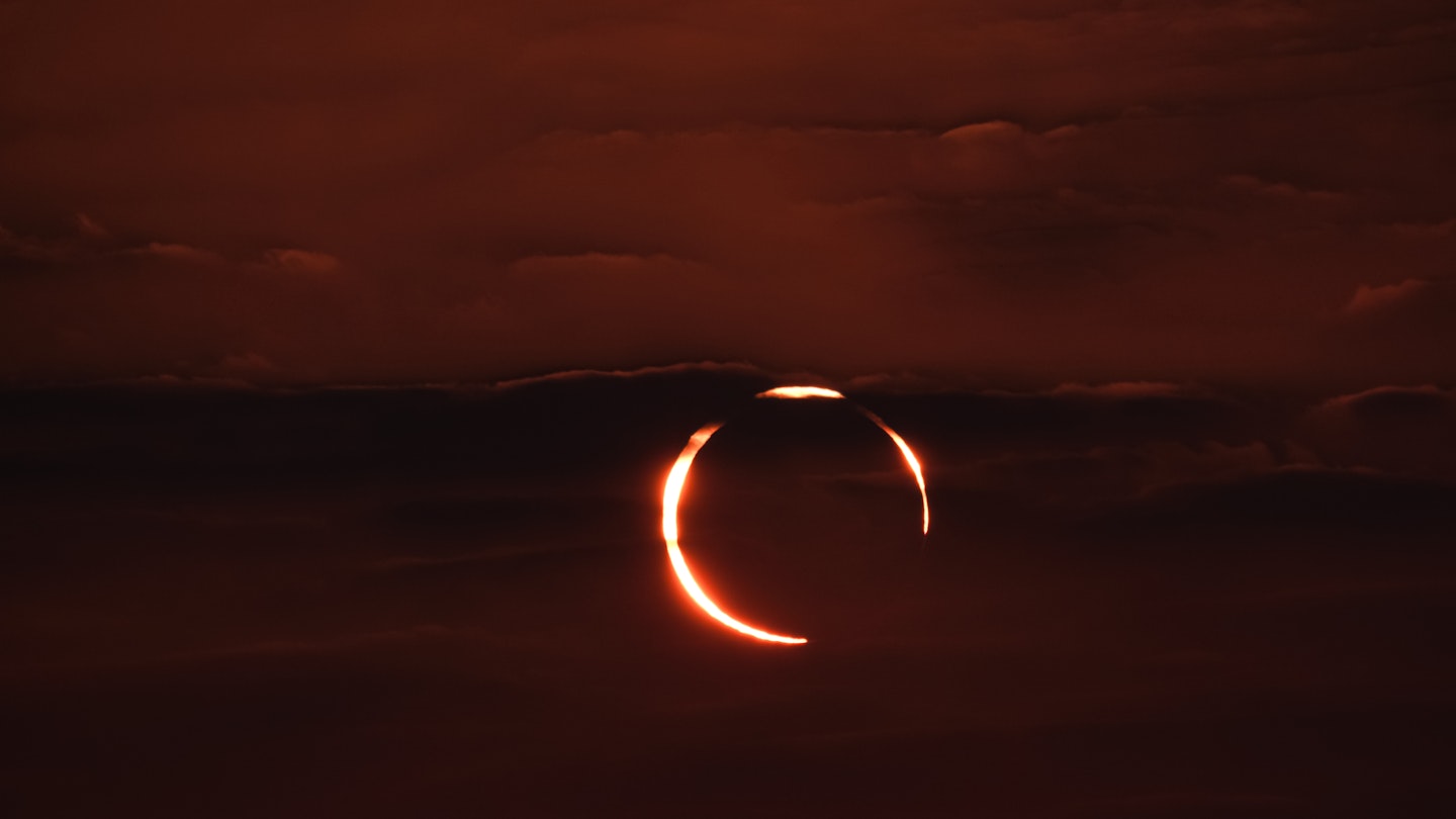 December 26, 2019. The rare Annular "ring of fire" solar eclipse as seen from the Corniche road in Doha, Qatar. Annular eclipses occur when the Moon is not close enough to the Earth to completely obscure the Sun, leaving a thin ring of the solar disc visible.