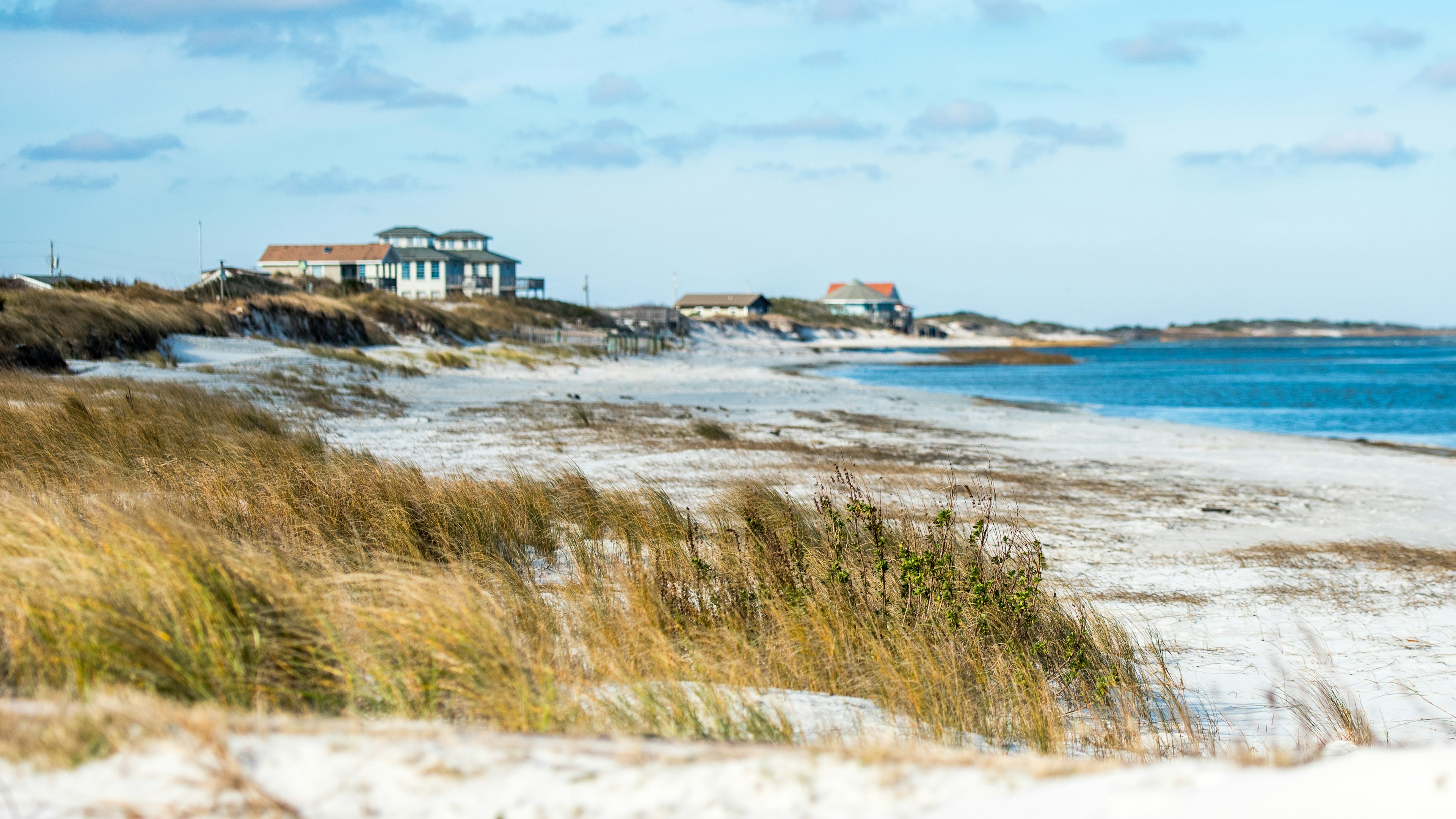 Beachfront houses on the sandy coast of North Carolina's Outer Banks