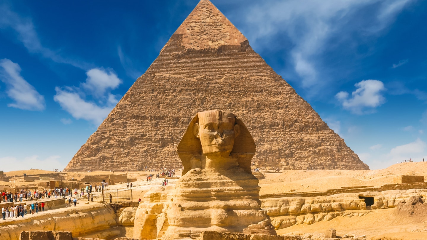 Great Sphinx of Giza with the Great Pyramid of Giza.