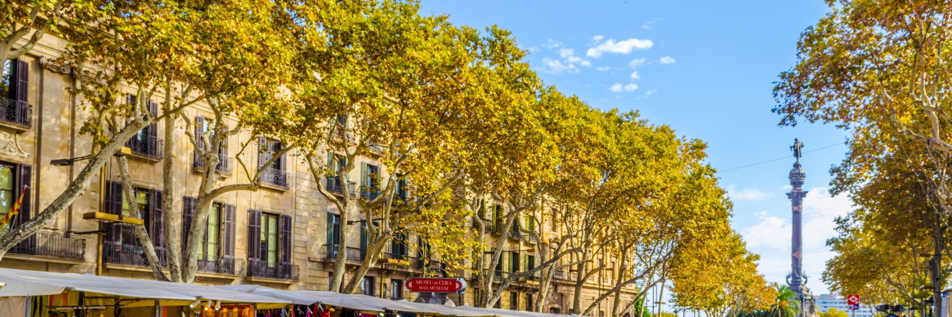 OCTOBER 26, 2014: People walking past market stalls on the La Rambla street in Barcelona.