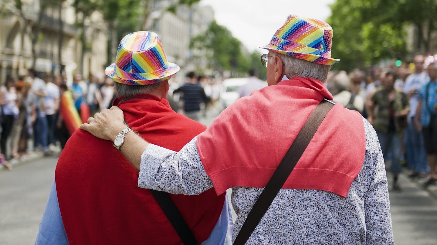PARIS - JUNE 30: Two elderly gays follow column of demonstrators at the Gay Pride on June 30, 2012 in Paris.