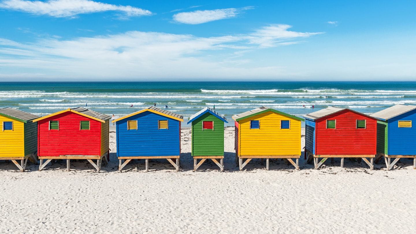The famous beach of Muizenberg (also known as surfers paradise), with its colorful beach boxes.
