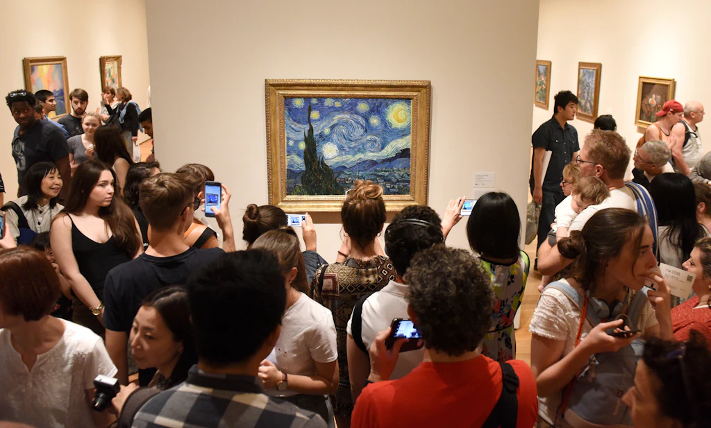 People admire a van Gogh painting