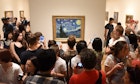 May 25, 2018: Crowd of people surround the Starry Night painting by Vincent van Gogh inside the Museum of Modern Art.