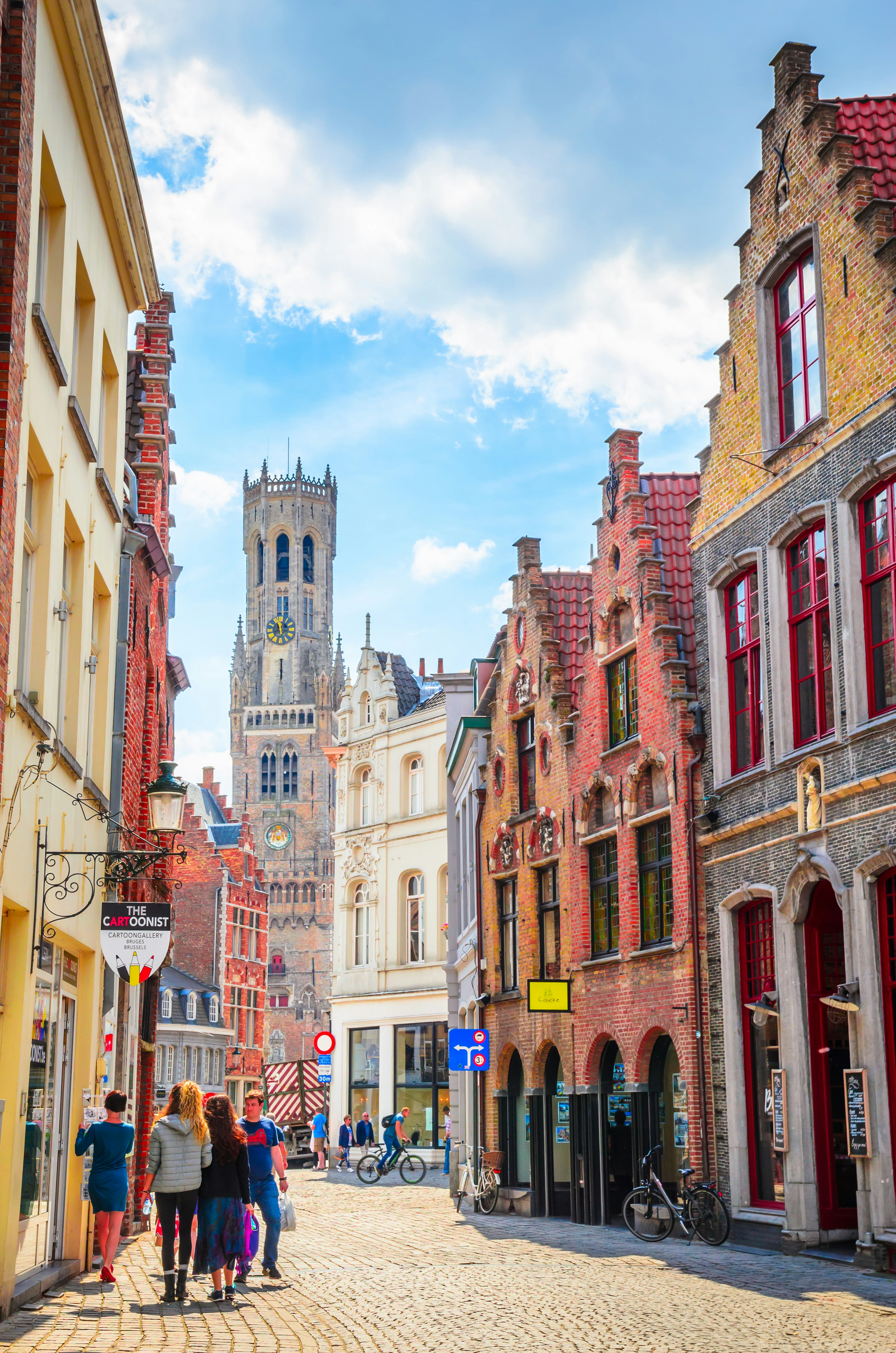 The Belfry Tower (aka Belfort) and traditional narrow streets in Bruges