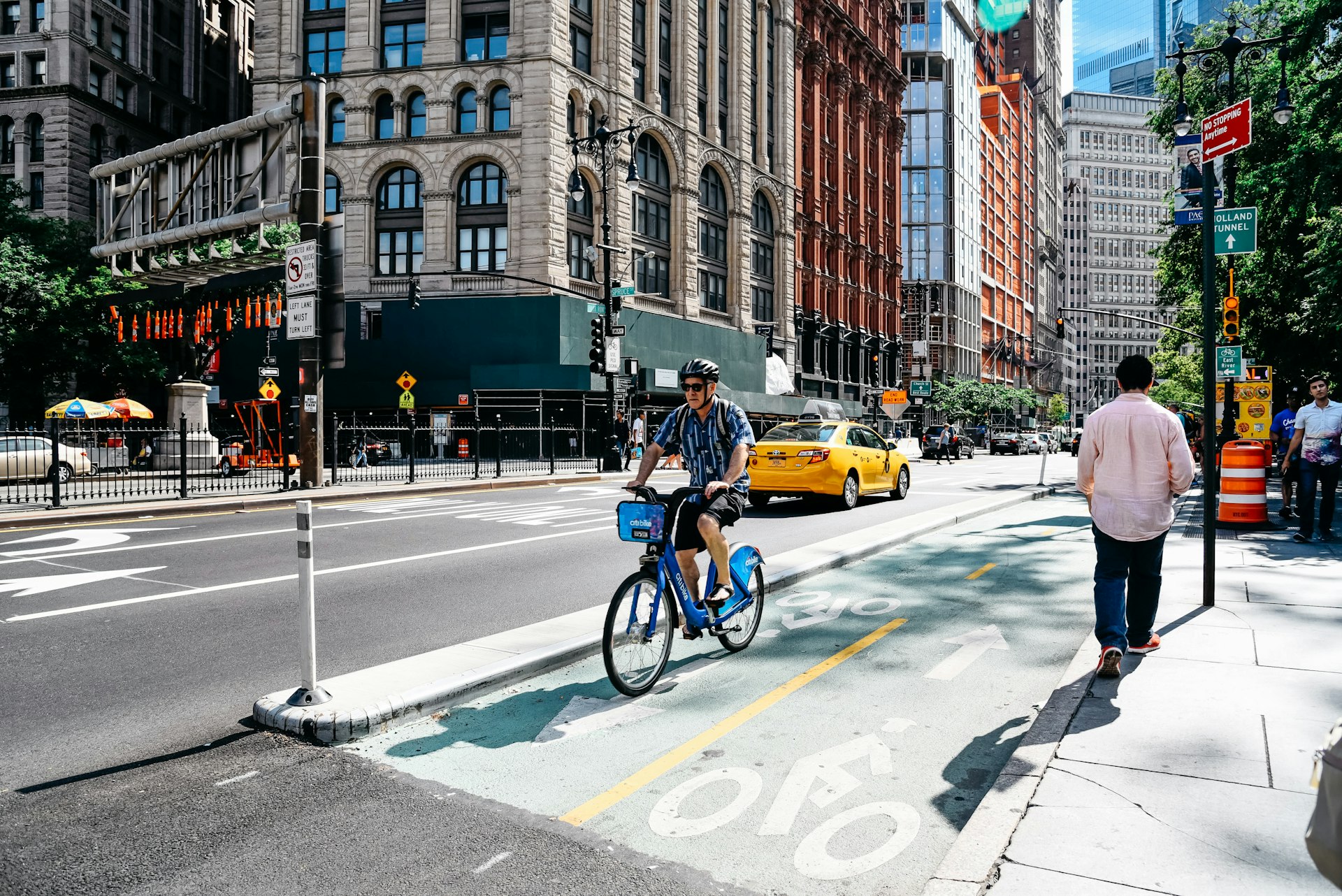 Cyclist riding in a bike lane in New York City's Park Row financial district