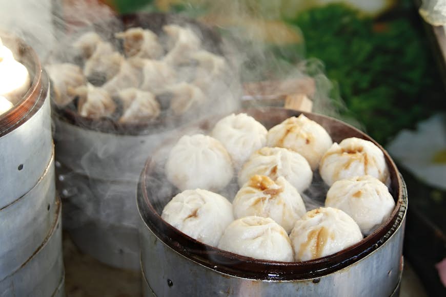 Street food stall selling Chinese specialty Steamed Dumplings in Beijing