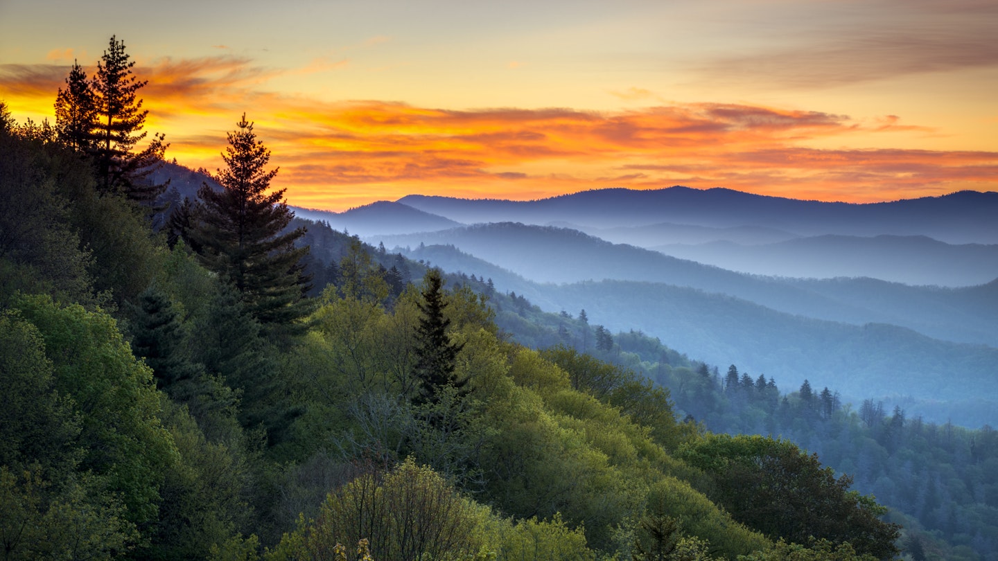 Sunrise over misty hills, as seen from Oconaluftee Overlook in the Great Smoky Mountains National Park.
